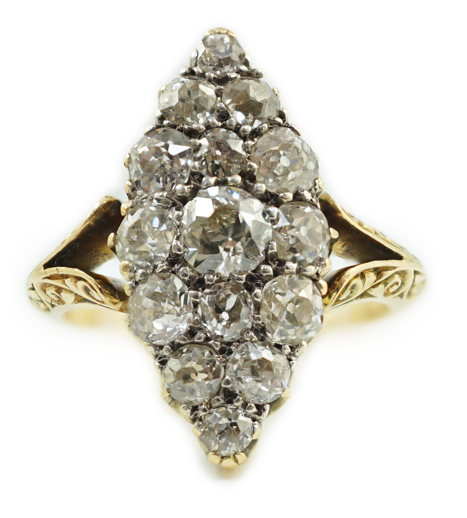 An early to mid 20th century 18ct gold and fifteen stone diamond cluster set marquise shaped ring